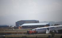 Passengers are lead away to safety. REUTERS/Navesh Chitrakar