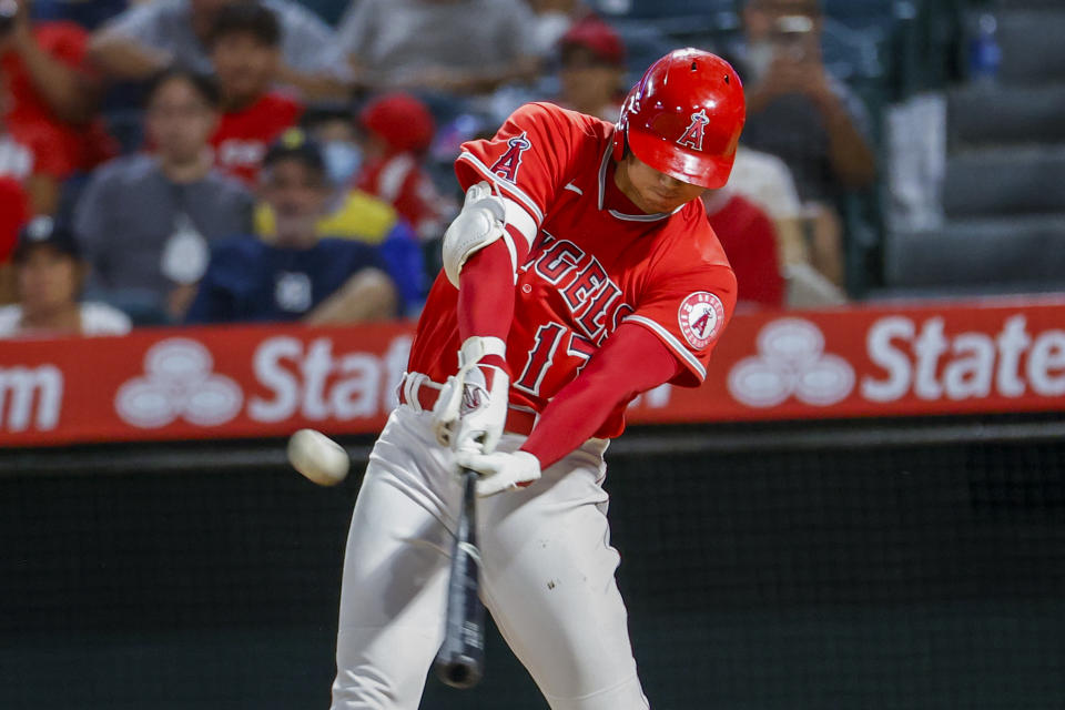 Los Angeles Angels' Shohei Ohtani hits a solo home run during the seventh inning of a baseball game against the Detroit Tigers in Anaheim, Calif., Monday, Sept. 5, 2022. (AP Photo/Ringo H.W. Chiu)