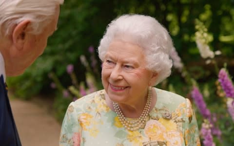 Sir David Attenborough joins Her Majesty the Queen in the gardens of Buckingham Palace - Credit: ITV