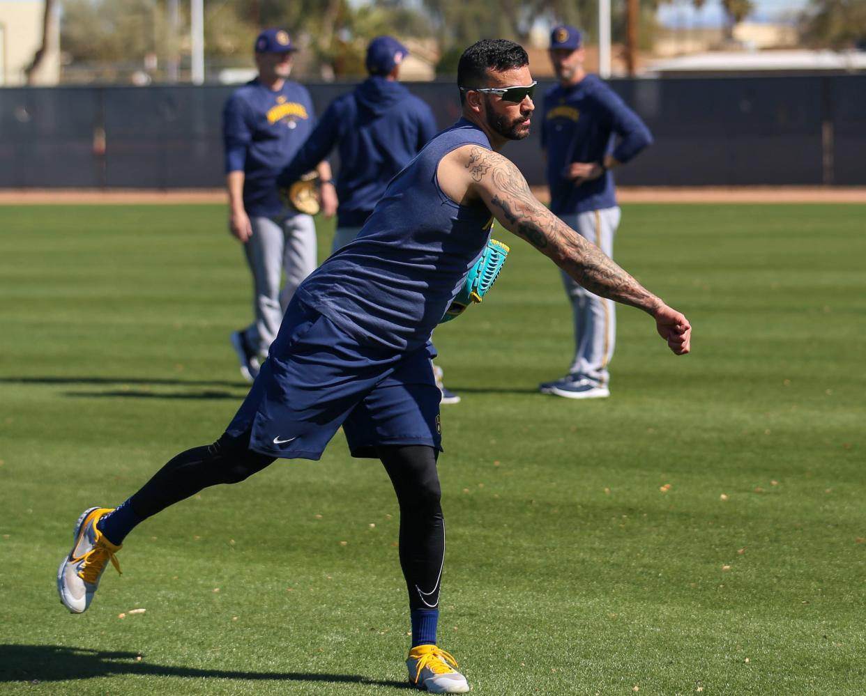 Brewers right handed pitcher Matt Bush warms up as pitchers and catchers reported for spring training Thursday in Surprise, Arizona.