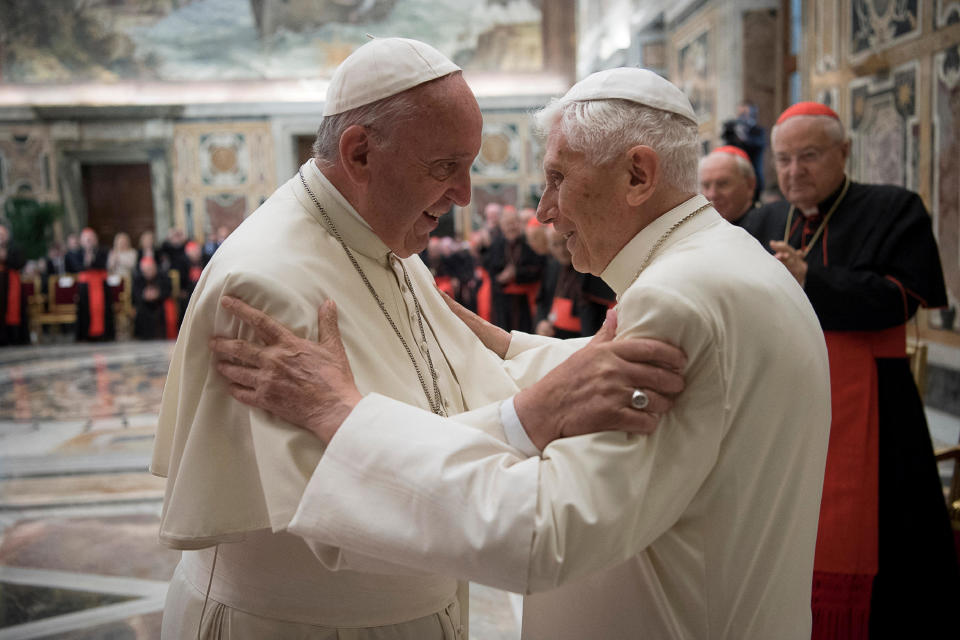 Former Pope Benedict, right, is greeted by Pope Francis during a ceremony to mark his 65th anniversary of ordination to the priesthood at the Vatican on June 28, 2016. / Credit: Vatican Media / REUTERS