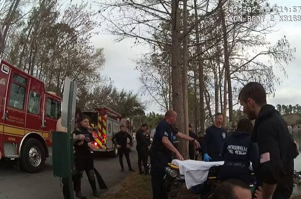 Jacksonville police and rescue personnel prepare to work on diver Victor Pierce Jr. on Feb. 12 at the Flamingo Lake RV Park on  Newcomb Road. This is an image from one of a number of police bodycams of the rescue effort.