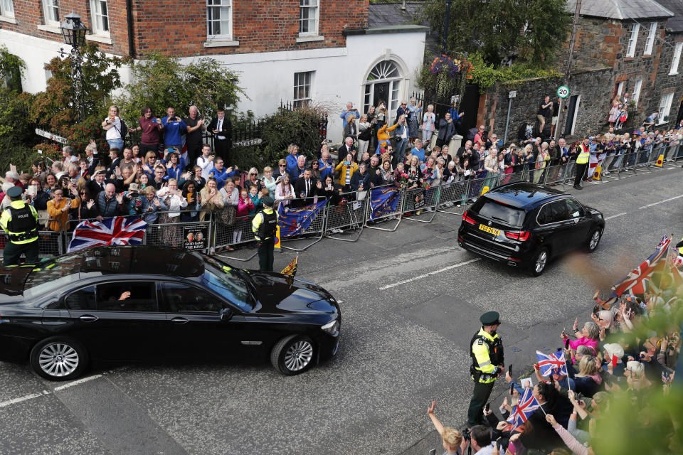 Britain's King Charles III waves to the public as he leaves after a visit to Hillsborough Castle, Northern Ireland, Tuesday, Sept. 13, 2022. (AP Photo/Peter Morrison)