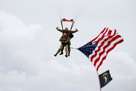 U.S. World War II paratrooper veteran Tom Rice, 97 years-old who served with the 101st Airbone, jumps during a commemorative parachute jump over Carentan on the Normandy coast