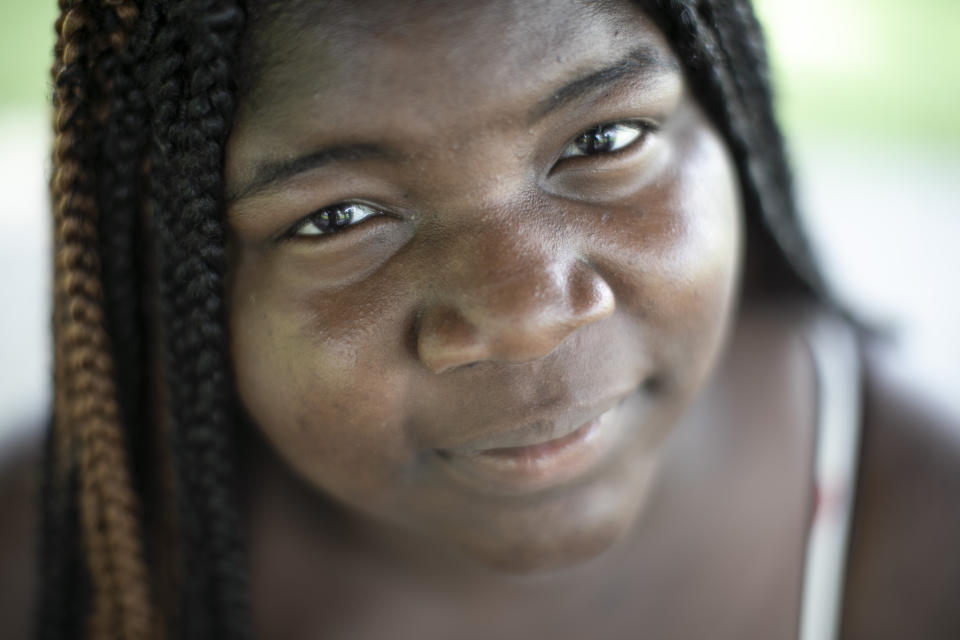 Takiyah Coleman 19, who organized a Black Lives Matter protest poses for a portrait in Anna City Park, Tuesday, Aug. 4, 2020, in Anna, Ill. "Sundown towns" like Anna were places where Black people were allowed in during the day to work or shop but had to be gone by nightfall. Today, some still exist in various forms, enforced now by tradition and fear rather than by rules. (AP Photo/Wong Maye-E)