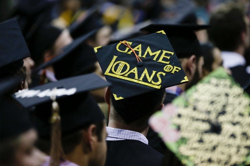 A recent Ohio State University graduate made his concern about being in debt for college known via his mortar board.