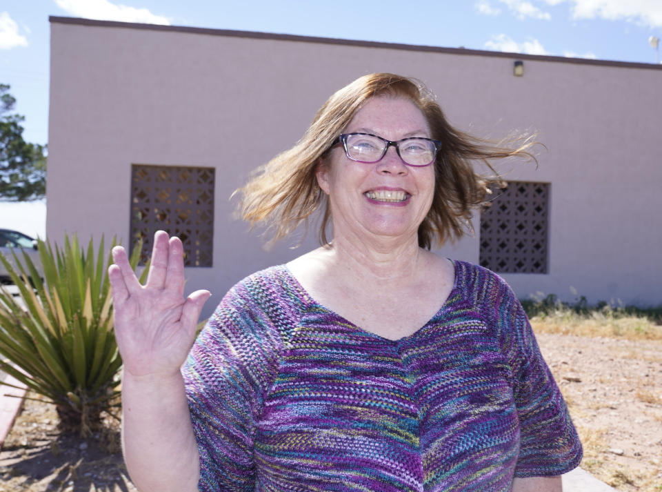 Van Horn Mayor Becky Brewster shows-off a Star Trek themed hand sign as she poses for a photo in Van Horn, Texas, Tuesday Oct. 12, 2021. The nearby Blue Origin launch site is 20 miles north of her city. (AP Photo/LM Otero)