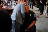 July 12, 2022: Stephen Ayres (L), who has pleaded guilty to entering the Capitol illegally on January 6, talks to US Capitol Police Officer Harry Dunn (R) at the conclusion of a full committee hearing on "the January 6th Investigation," on Capitol Hill in Washington, DC.