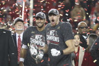 San Francisco 49ers quarterback Jimmy Garoppolo (10) and tight end George Kittle (85) enjoy a confetti celebration after the NFL NFC Championship football game against the Green Bay Packers, Sunday, Jan. 19, 2020 in Santa Clara, Calif. (Margaret Bowles via AP)