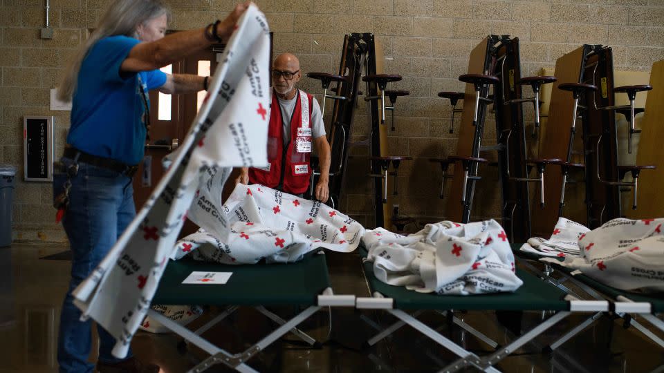 American Red Cross workers prepare cots in Houston, Texas, on Wednesday. - Mark Felix/Bloomberg/Getty Images