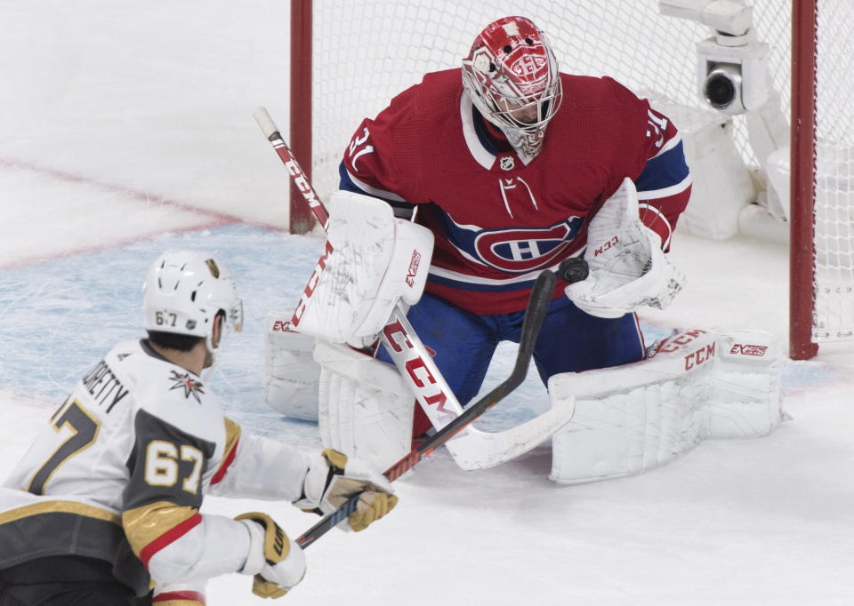 Vegas Golden Knights' Max Pacioretty (67) shoots against Montreal Canadiens goaltender Carey Price during first-period NHL hockey game action in Montreal, Saturday, Jan. 18, 2020. (Graham Hughes/The Canadian Press via AP)