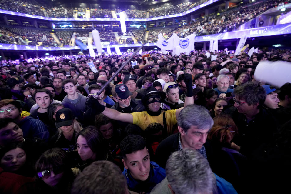 Supporters of presidential hopeful of the Liberty Advances coalition Javier Milei attend a campaign rally in Buenos Aires, Argentina, Wednesday, Oct. 18, 2023. General elections are set for Oct. 22. (AP Photo/Natacha Pisarenko)