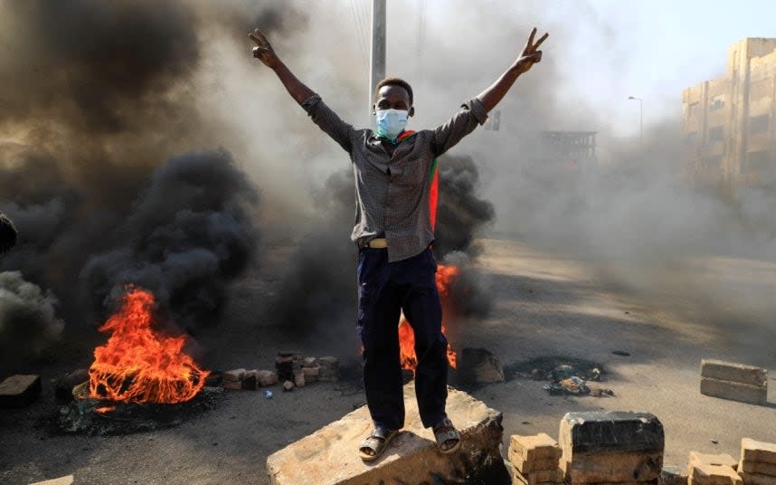 Sudanese protesters burn tyres in the capital Khartoum - AFP
