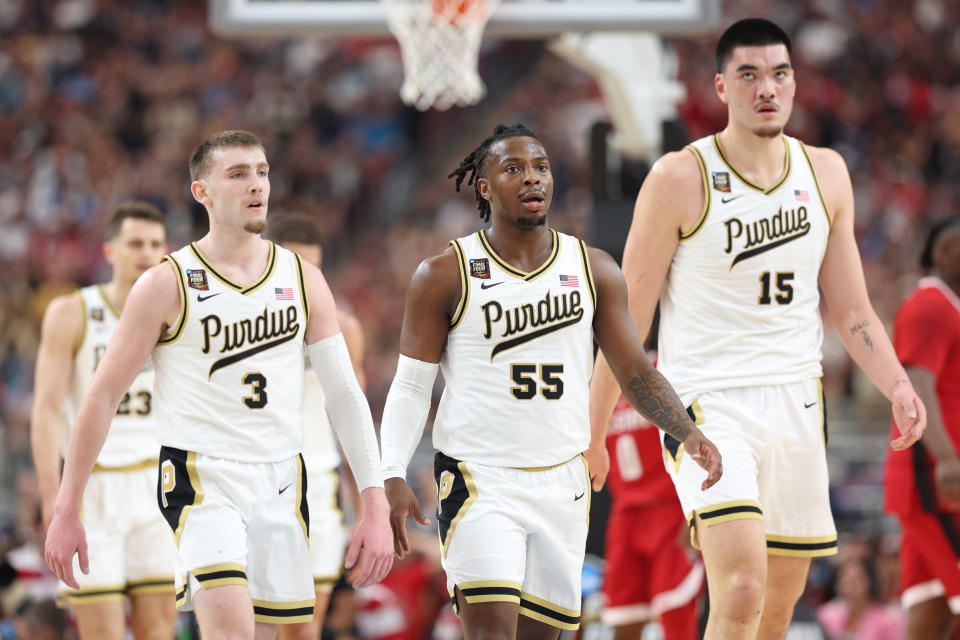 Purdue guards Braden Smith (3) and Lance Jones (55) will play critical roles in support of big man Zach Edey (15) in Monday's NCAA title game against UConn. (Photo by Jamie Squire/Getty Images)