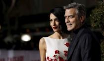 Cast member George Clooney and his wife Amal pose at the premiere of "Hail, Caesar!" in Los Angeles, California February 1, 2016. The movie opens in the U.S. on February 5. REUTERS/Mario Anzuoni