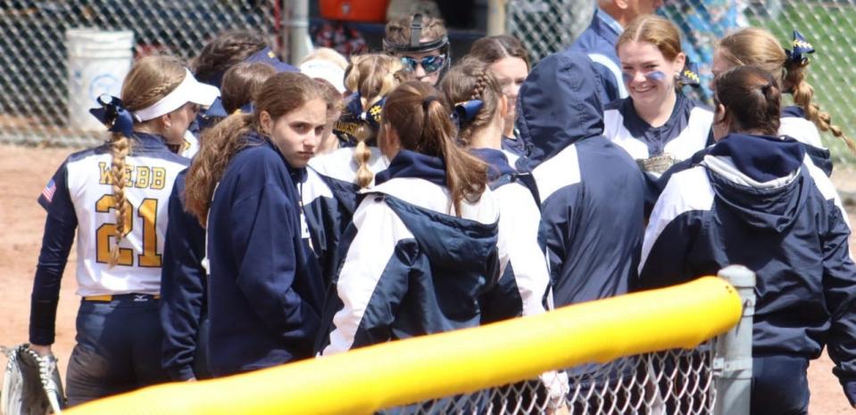 Whiteford huddles between innings while winning its own tournament Saturday.