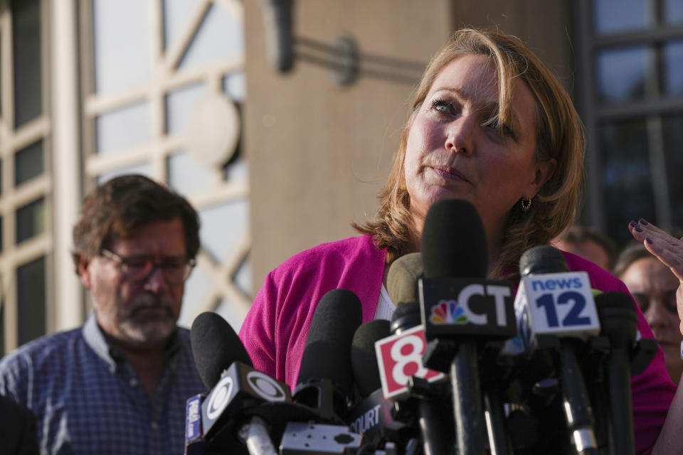 Nicole Hockley, whose son Dylan was one of the victims of the Sandy Hook Elementary School shooting, speaks to the media after jurors returned a $965 million dollar judgement in the defamation trial against Alex Jones, in Waterbury, Conn, Wednesday, Oct. 12, 2022. (AP Photo/Bryan Woolston)