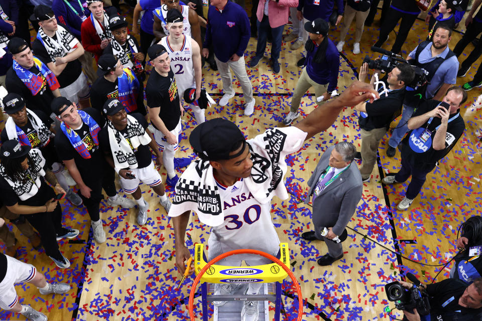 NEW ORLEANS, LOUISIANA - APRIL 04: Ochai Agbaji #30 of the Kansas Jayhawks cuts down the net after defeating the North Carolina Tar Heels during the second half of the 2022 NCAA Men&#39;s Basketball Tournament National Championship game at Caesars Superdome on April 04, 2022 in New Orleans, Louisiana. (Photo by Handout/NCAA Photos via Getty Images)