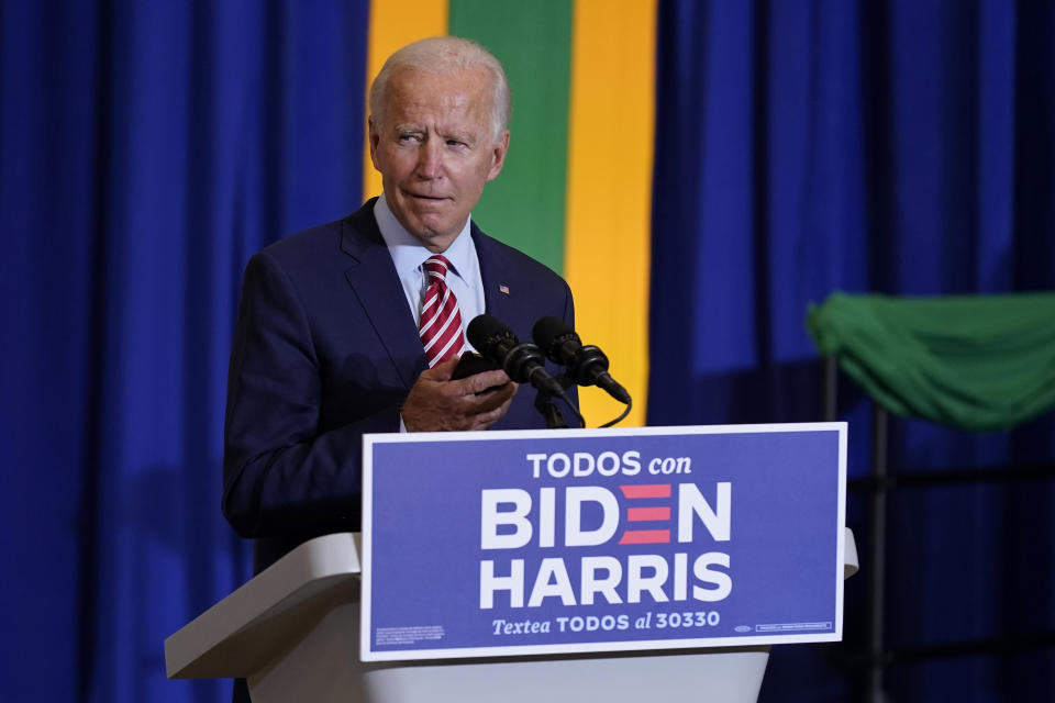 Democratic presidential candidate former Vice President Joe Biden plays music on a phone as he arrives to speak at a Hispanic Heritage Month event, Tuesday, Sept. 15, 2020, at Osceola Heritage Park in Kissimmee, Fla. (AP Photo/Patrick Semansky)