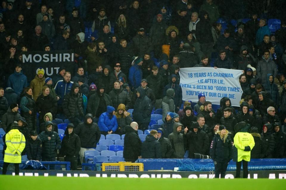 Everton fans hold up banners in protest against the club’s board (Peter Byrne/PA) (PA Wire)
