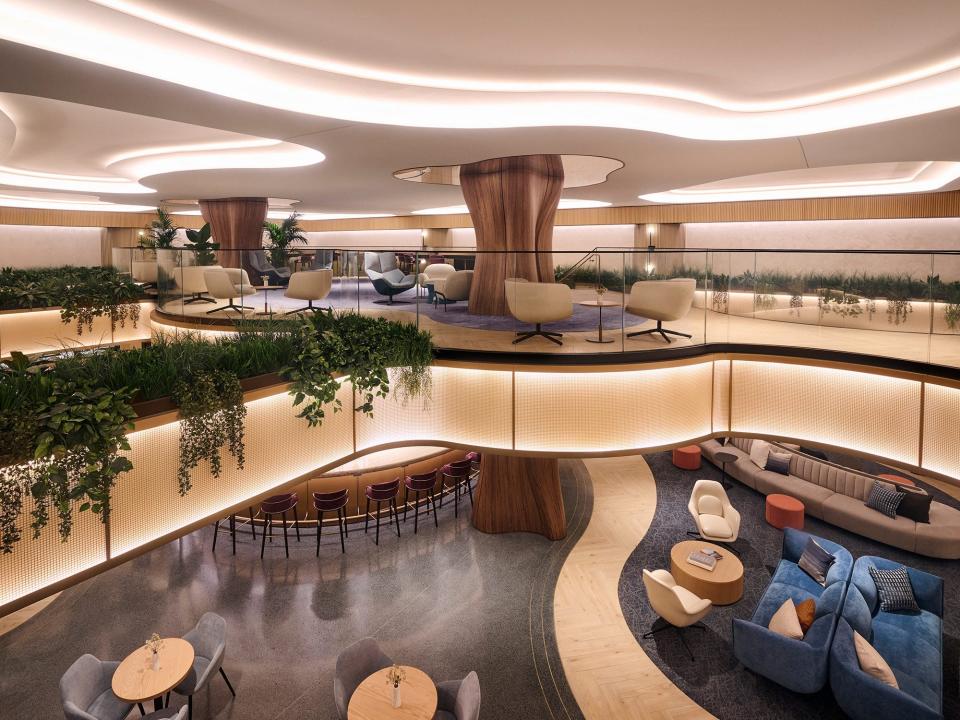 A curved mezzanine overlooks the main floor of the new Chase Sapphire Lounge in LaGuardia.