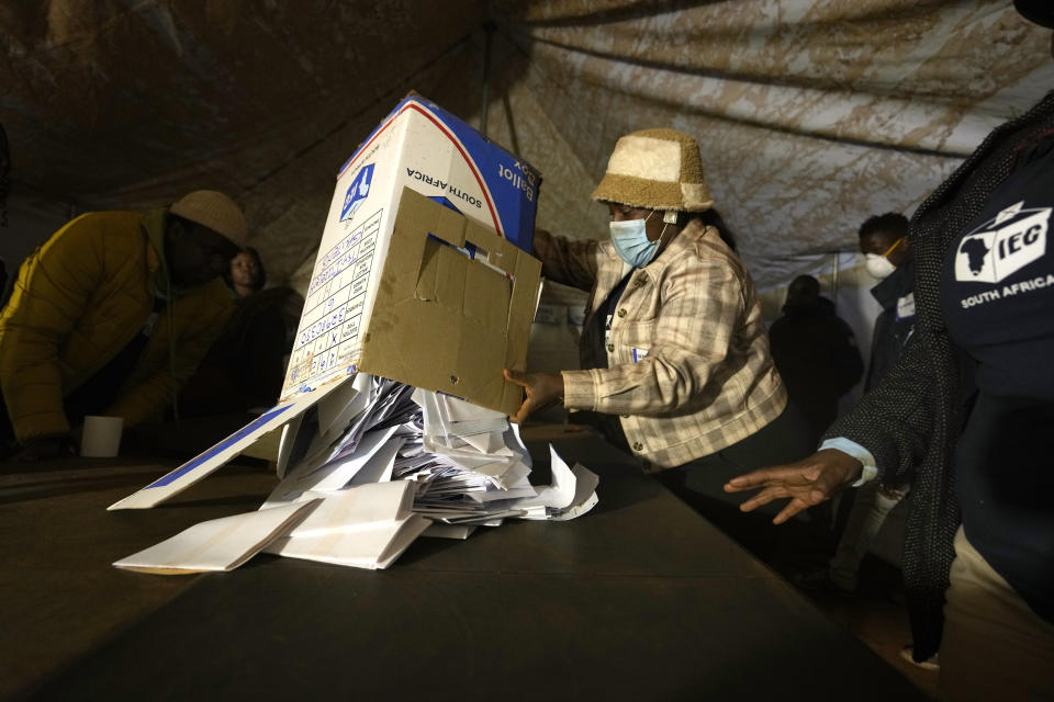 Electoral workers empties the ballot box during the counting at Itireleng informal settlement in Pretoria, South Africa, Wednesday, May 29, 2024, during the general elections. AP Photo/Themba Hadebe)