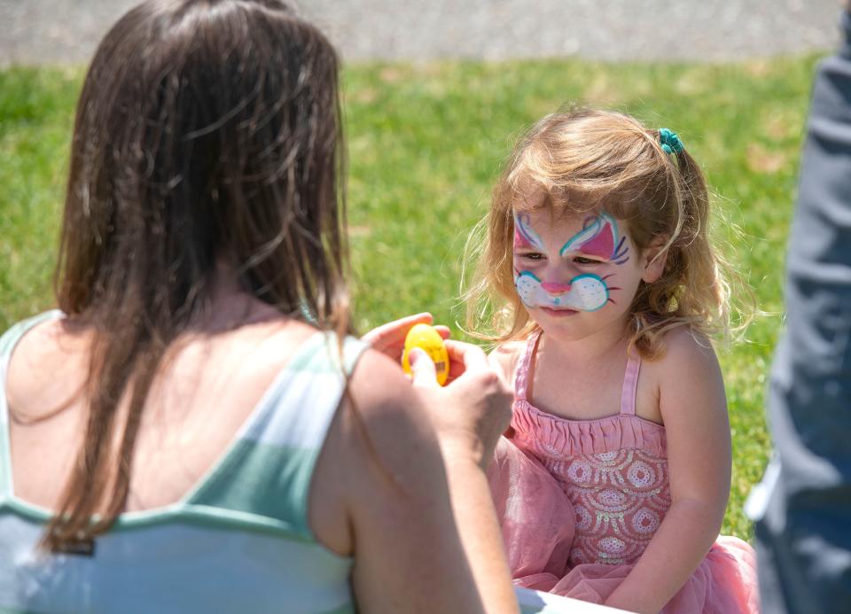 Kids take part in the Echo Life Church Community Easter Egg Hunt Sunday, April 10, 2022 at Pensacola State College. The event included an egg hunt, bounce house, face painting and free food.
