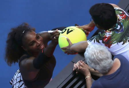 Tennis - Australian Open - Melbourne Park, Melbourne, Australia - 23/1/17 Serena Williams of the U.S. signs autographs after winning her Women's singles fourth round match against Czech Republic's Barbora Strycova. REUTERS/Jason Reed