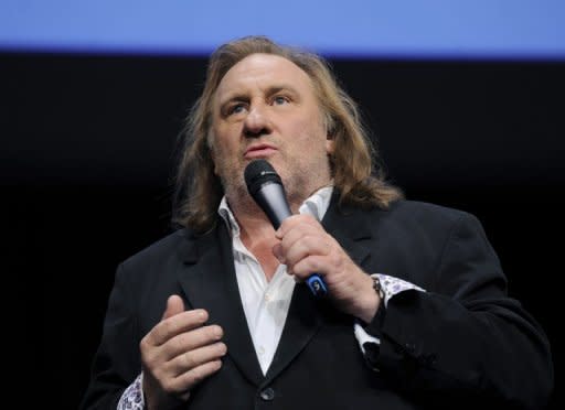 French actor Gerard Depardieu speaks during the third edition of the Lumiere film festival in the French city of Lyon on October 8, 2011. Depardieu said on Thursday he would play the "arrogant, smug" former IMF chief Dominique Strauss-Kahn in a film about his fall from grace in a series of sex scandals