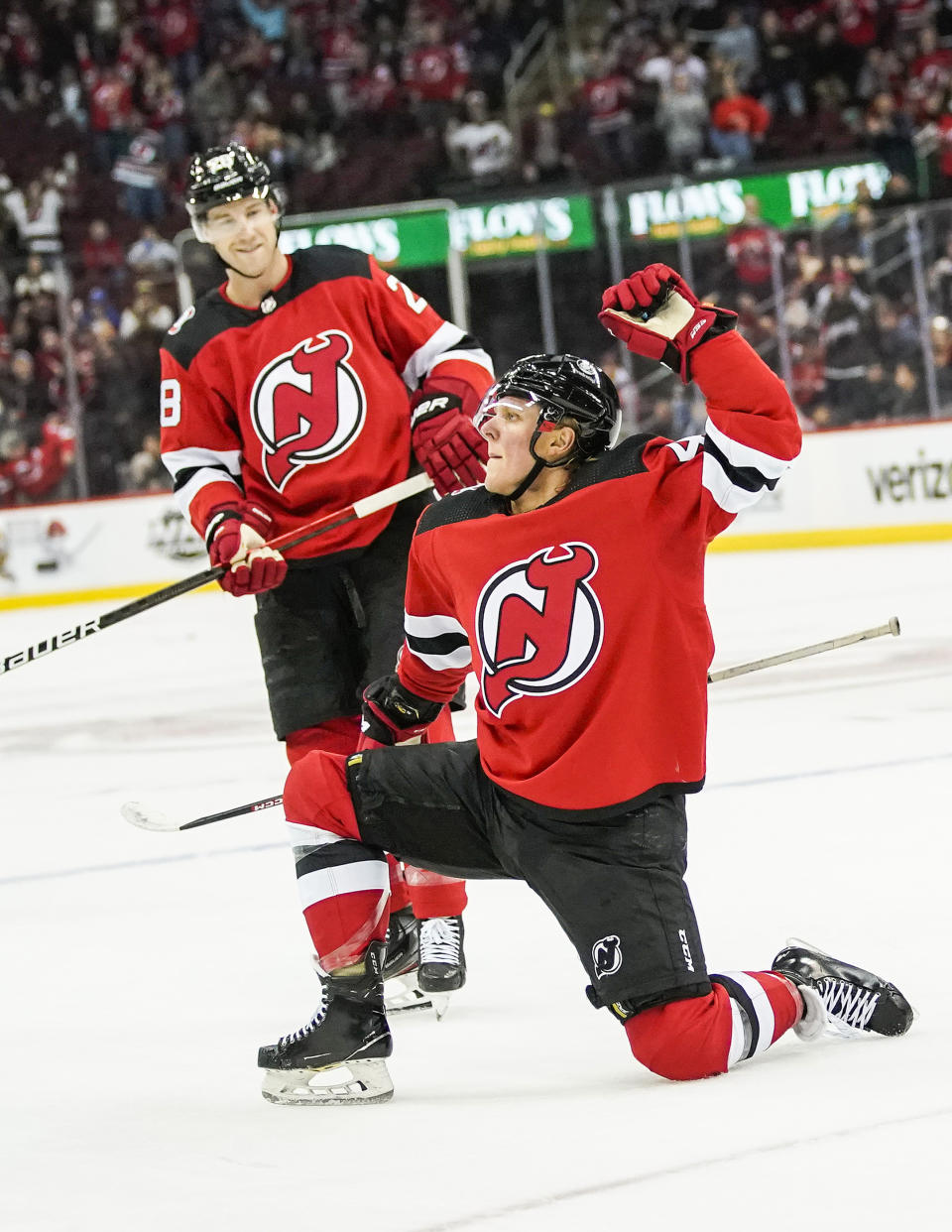 New Jersey Devils left wing Fabian Zetterlund, right, celebrates his goal against the Columbus Blue Jackets during an NHL hockey game, Sunday, Oct. 30, 2022, in Newark, N.J. (AP Photo/Eduardo Munoz Alvarez)