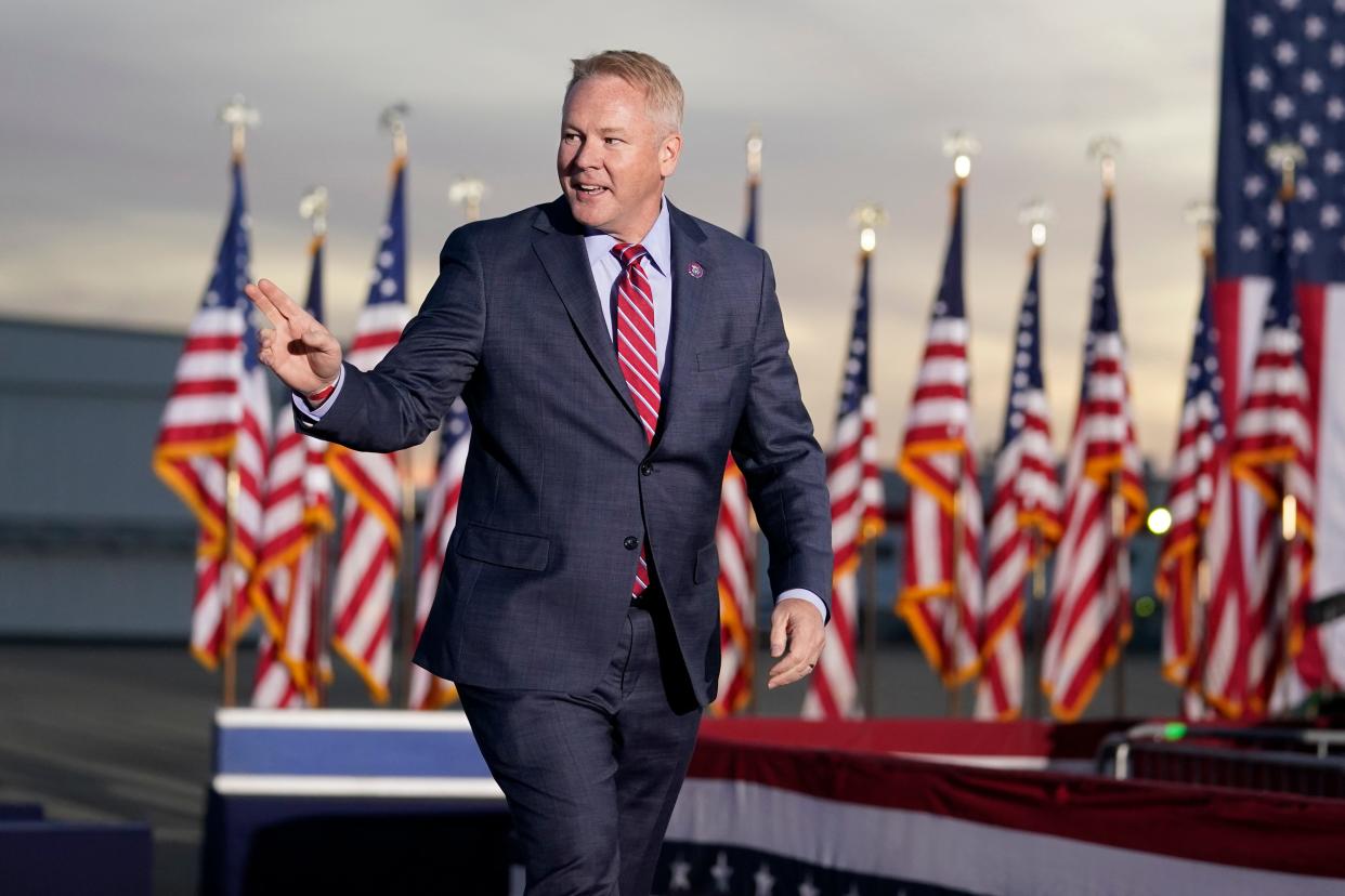 Rep. Warren Davidson, R-Ohio, arrives to speak before former President Donald Trump at a rally in support of the campaign of Ohio Senate candidate JD Vance at Wright Bros. Aero Inc. at Dayton International Airport on Monday, Nov. 7, 2022, in Vandalia, Ohio. (AP Photo/Michael Conroy)