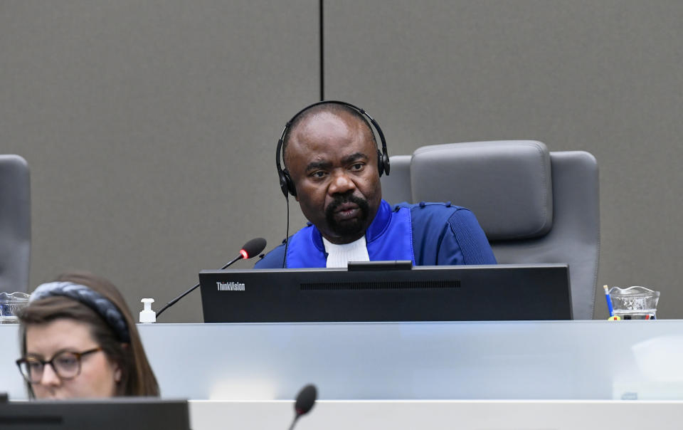 Judge Antoine Kesia-Mbe Mindua attends the trial of Al Hassan Ag Abdoul Aziz Ag Mohamed Ag Mahmoud, a Malian rebel accused of policing a brutal Islamic regime in the Malian city of Timbukti after rebels overran the historic desert city in 2012, at the International Criminal Court in The Hague, Netherlands, Monday May 9, 2022. (Piroschka van de Wouw/Pool via AP)