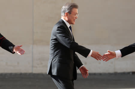 South Korean President Moon Jae-in is welcomed as he arrives to attend a meeting with Pope Francis at the Vatican, October 18, 2018. REUTERS/Tony Gentile