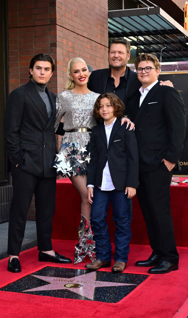 US singer Gwen Stefani poses with her husband Blake Shelton and her sons Kingston, Zuma, and Apollo Rossdale on her just-unveiled Hollywood Walk of Fame Star during a ceremony in Hollywood, California on October 19, 2023. <em>Photo by FREDERIC J. BROWN/AFP via Getty Images.</em>