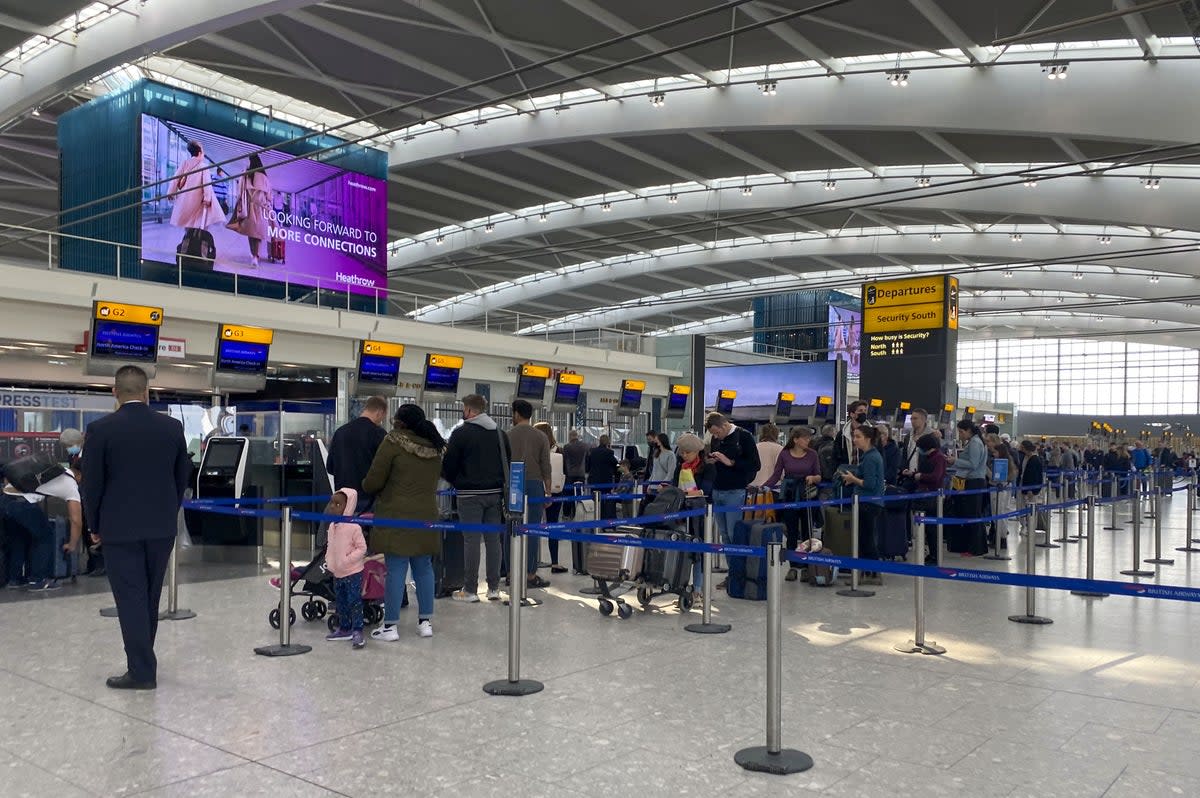 Passengers queue to check-in bags in departures at Terminal 5 of Heathrow Airport, west London (Steve Parsons/PA) (PA Wire)