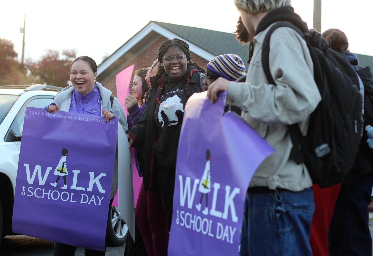 North Eugene High School sophomores and Black Student Union members Jazmin Berry, left, and Raia Solomon-Burt, center, walk from DaySpring Fellowship to North Eugene High School for the Ruby Bridges Walk to School Day on Monday, Nov. 14, 2022.