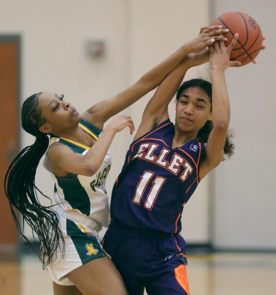 Firestone's Ayana Smith pressures Ellet's Trinity Brown during the fourth quarter of Thursday night's City Series game. Ellet won 61-21. [Phil Masturzo/Beacon Journal]