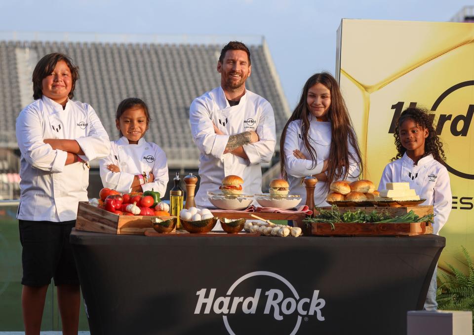 Community Kids and Leo Messi, introduce "The Hard Rock Messi Kids Menu" during the launch event at DRV PNK Stadium on October 2, 2023, in Ft Lauderdale, Fla. The menu items will be available at participating Hard Rock Cafes and select Hard Rock Hotels & Casinos worldwide starting October 3