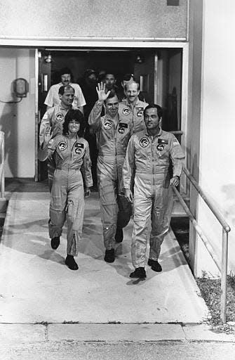 This photo shows the crew of space shuttle Challenger leaving for boarding at Kennedy Space Center in Florida early morning on June 18, 1983. Sally Ride and Robert Crippen are in front, John Fabian is in the middle and Norm Thagard and Rick Hauck are in the rear.