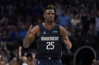 Dallas Mavericks forward Reggie Bullock (25) reacts after scoring against the Phoenix Suns during the second half of Game 6 of an NBA basketball second-round playoff series, Thursday, May 12, 2022, in Dallas. (AP Photo/Tony Gutierrez)