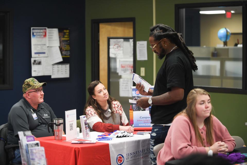 An attendees speaks with TCAT reps during the Dept. of Corrections Job Fair at the TDOC Communty Resource Center in Jackson, Tenn., on Thursday, March 28, 2024. in Jackson, Tenn., on Thursday, March 28, 2024.