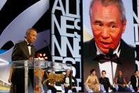 Taiwanese director Hou Hsiao-Hsien talks on stage after being awarded with the Best Director prize during the closing ceremony of the 68th Cannes Film Festival in Cannes, France, on May 24, 2015