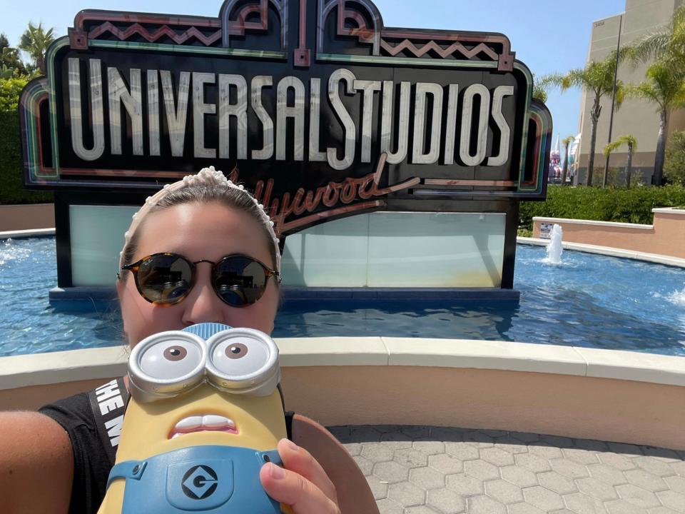 carly posing in front of universal studios hollywood sign