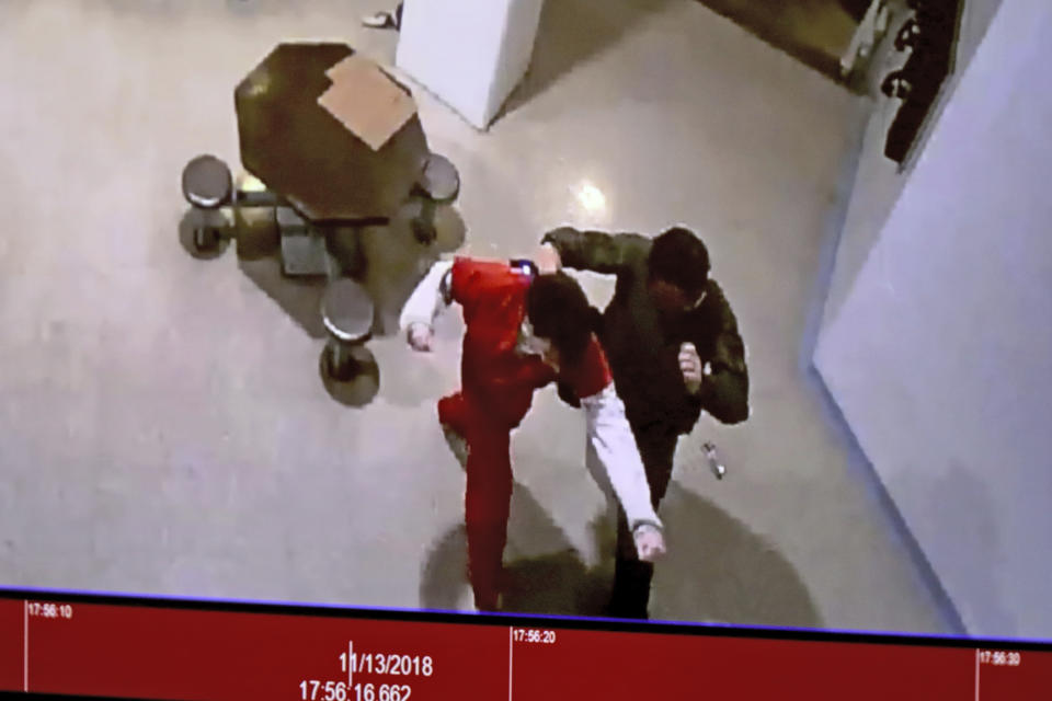 A November 2018 video is shown in court of Parkland school shooter Nikolas Cruz in an altercation with Broward jail guard Sgt. Ray Beltran during a Cruz's pre-trial hearing at the Broward County Courthouse in Fort Lauderdale, Fla., Wednesday, July 14, 2021, on four criminal counts stemming from his alleged attack. Cruz is accused of punching Sgt. Ray Beltran, wrestling him to the ground and taking his stun gun. (Amy Beth Bennett/South Florida Sun-Sentinel via AP, Pool)