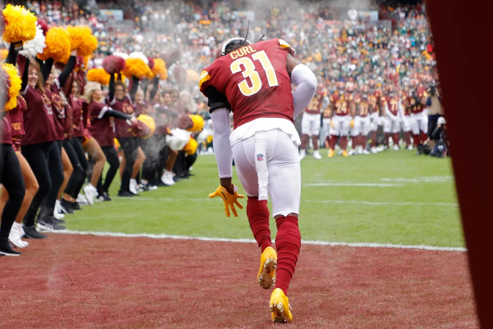 Oct 23, 2022; Landover, Maryland, USA; Washington Commanders safety Kamren Curl (31) runs onto the field during player introductions prior to the game against the Green Bay Packers at FedExField. Mandatory Credit: Geoff Burke-USA TODAY Sports