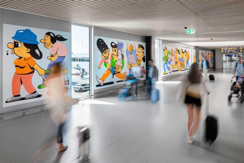 Artwork lines a walkway at the Copenhagen Airport, in Denmark