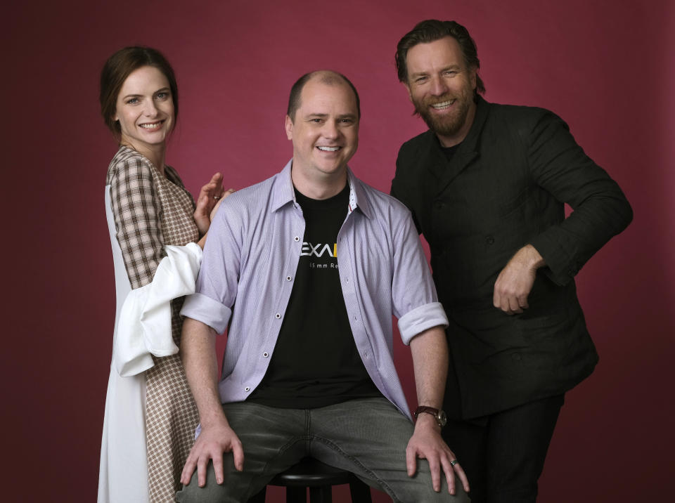 This Oct. 28, 2019 photo shows writer-director Mike Flanagan, center, and actors Rebecca Ferguson, left, and Ewan McGregor posing for a portrait to promote the film, "Doctor Sleep," at The London West Hollywood hotel in West Hollywood, Calif. (Photo by Chris Pizzello/Invision/AP)