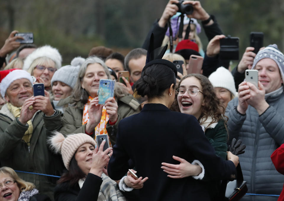 Britain's Meghan, Duchess of Sussex meets members of the crowd after attending the Christmas day service at St Mary Magdalene Church in Sandringham in Norfolk, England, Tuesday, Dec. 25, 2018. (AP Photo/Frank Augstein)