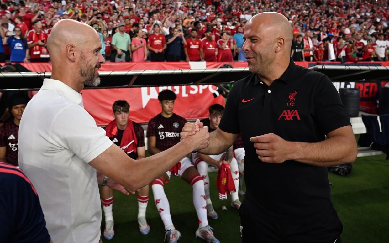 Liverpool head coach Arne Slot greets Manchester United's Erik ten Hag during a pre-season friendly at Williams-Brice Stadium, 3 August, 2024 in Columbia, South Carolina