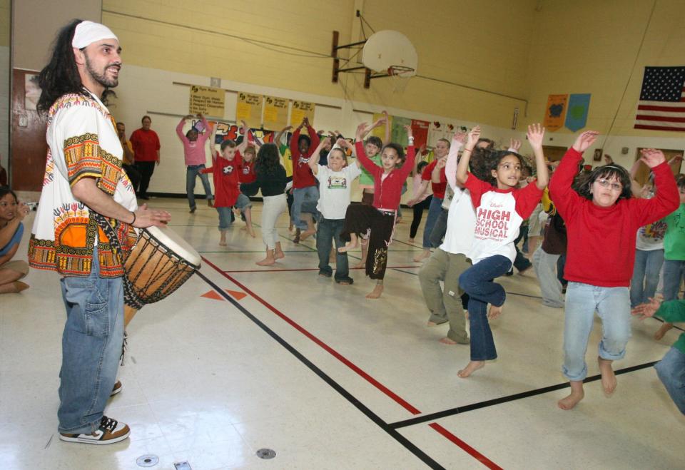 Cecilio Negron Jr., pictured here in 2007, gets the Dean School 4th graders moving to a new beat as they perform for their schoolmates and parents at the March 22nd wrap-up of the week-long Artist-In-Residence program sponsored by the Brown Deer Junior Womens Club.